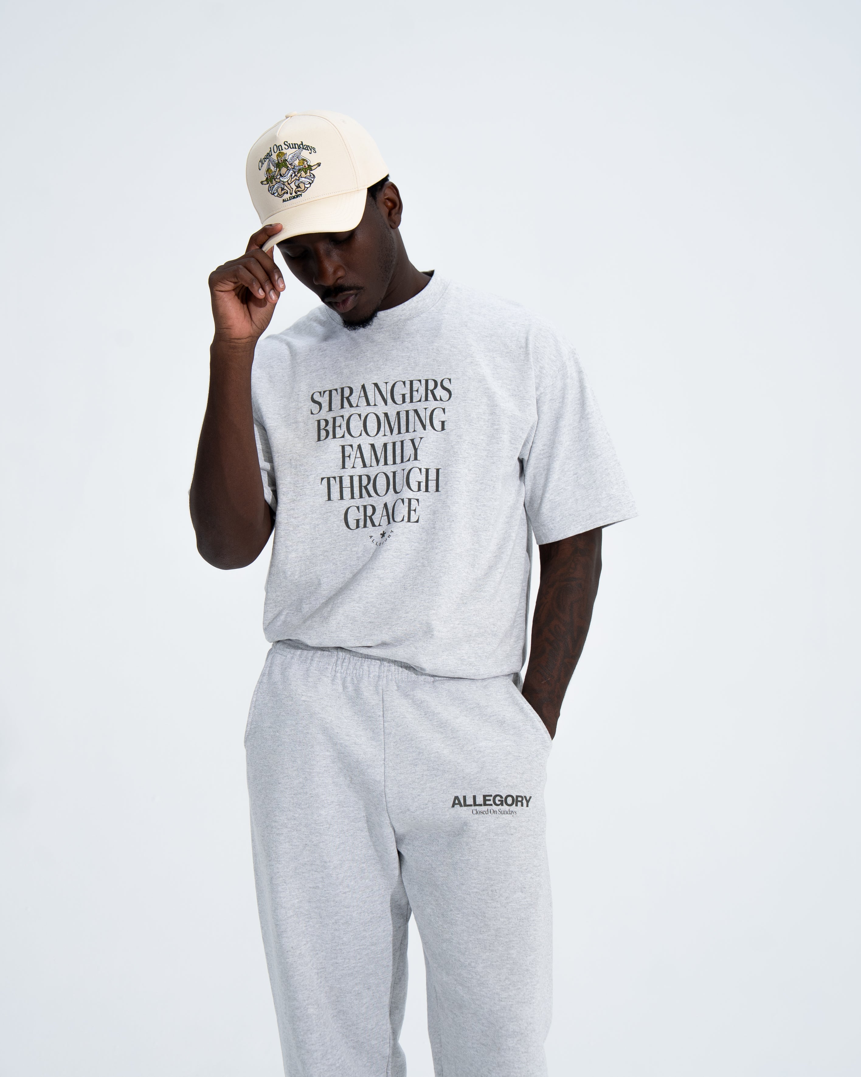 Strangers Becoming Family Through Grace Tee-2