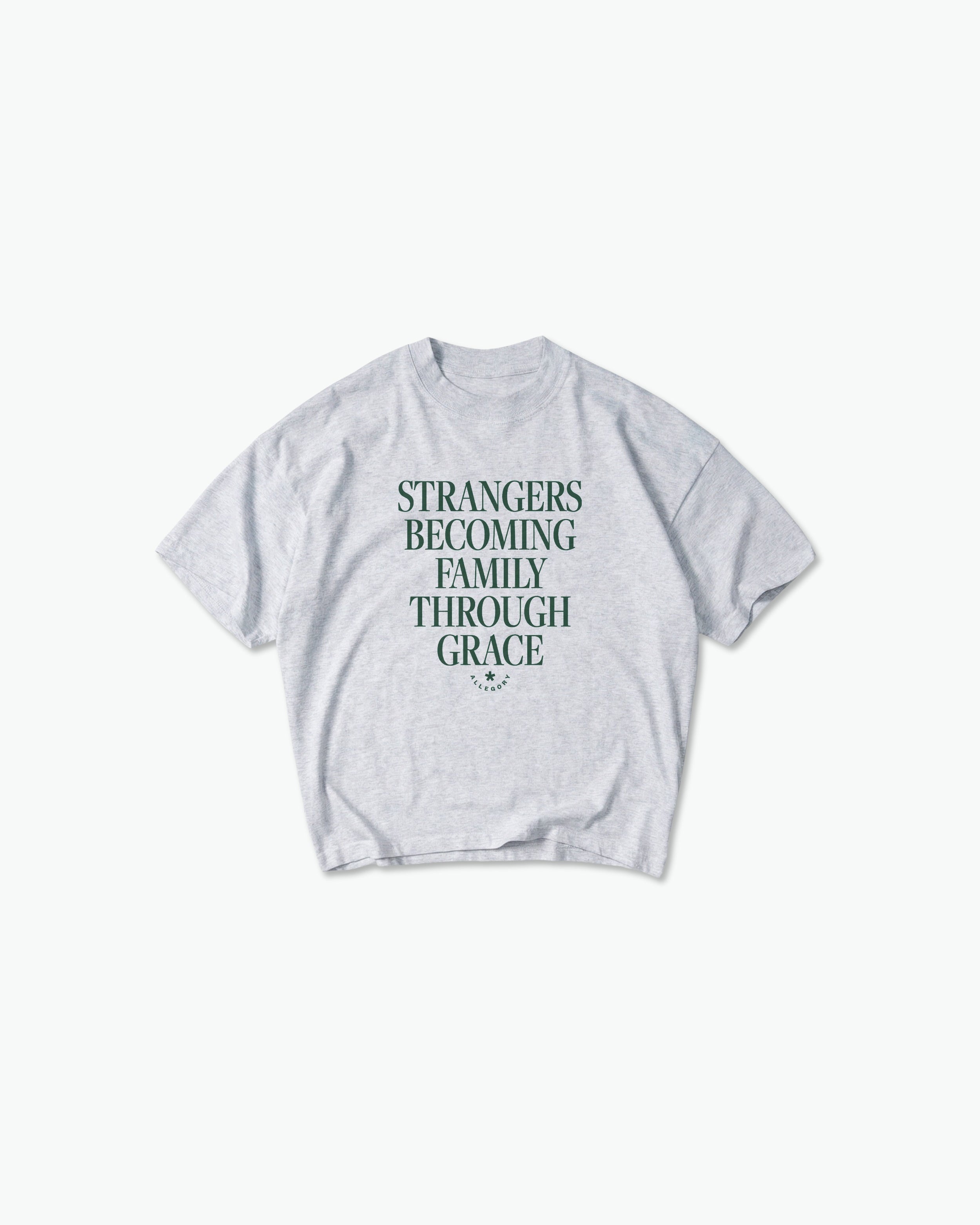 Strangers Becoming Family Through Grace Tee-1